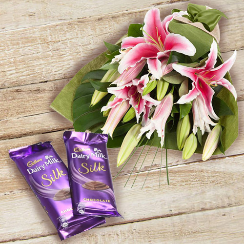 Impressive Pink Lilies Bouquet and Dairy Milk Silk