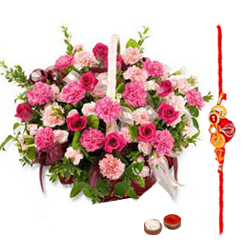 Pretty Gift Arrangement of Roses and Seasonal Flowers in a Basket with free Rakhi Roli Tika and Chawal for Special Rakhi Festival