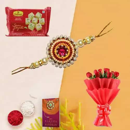 Delicious Soan Papri and Attractive Red Roses Bunch with Rakhi Roli Tika and Chawal for your Loving Brother