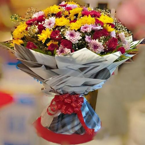 Luxurious Tissue Wrapped Bouquet of Colorful Flowers