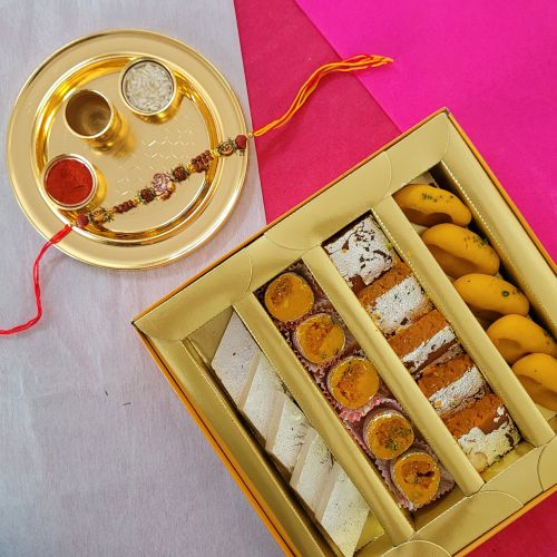 Astonishing Ganesh Rakhi with Sweets  N  Golden Rakhi Thali